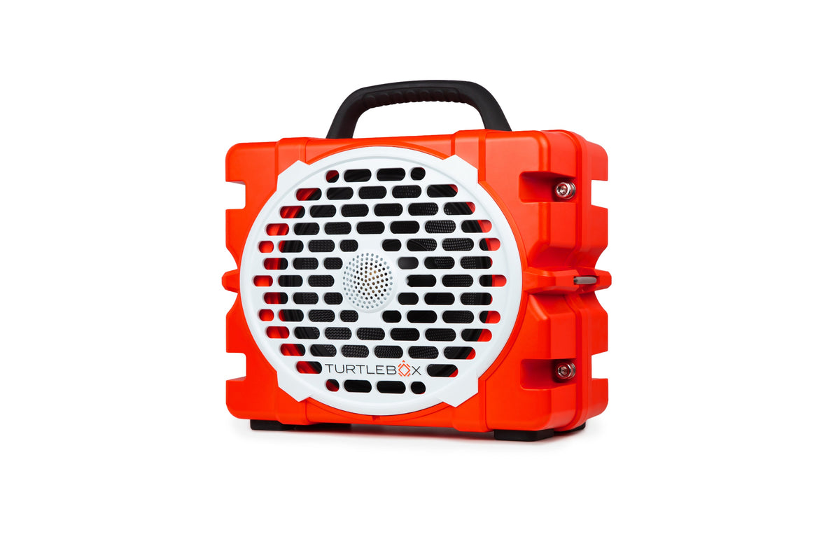 Orange and White portable Turtlebox speaker on a white background