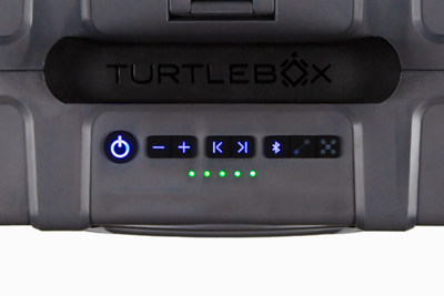 Tan and White portable Turtlebox speaker top-view on a white background