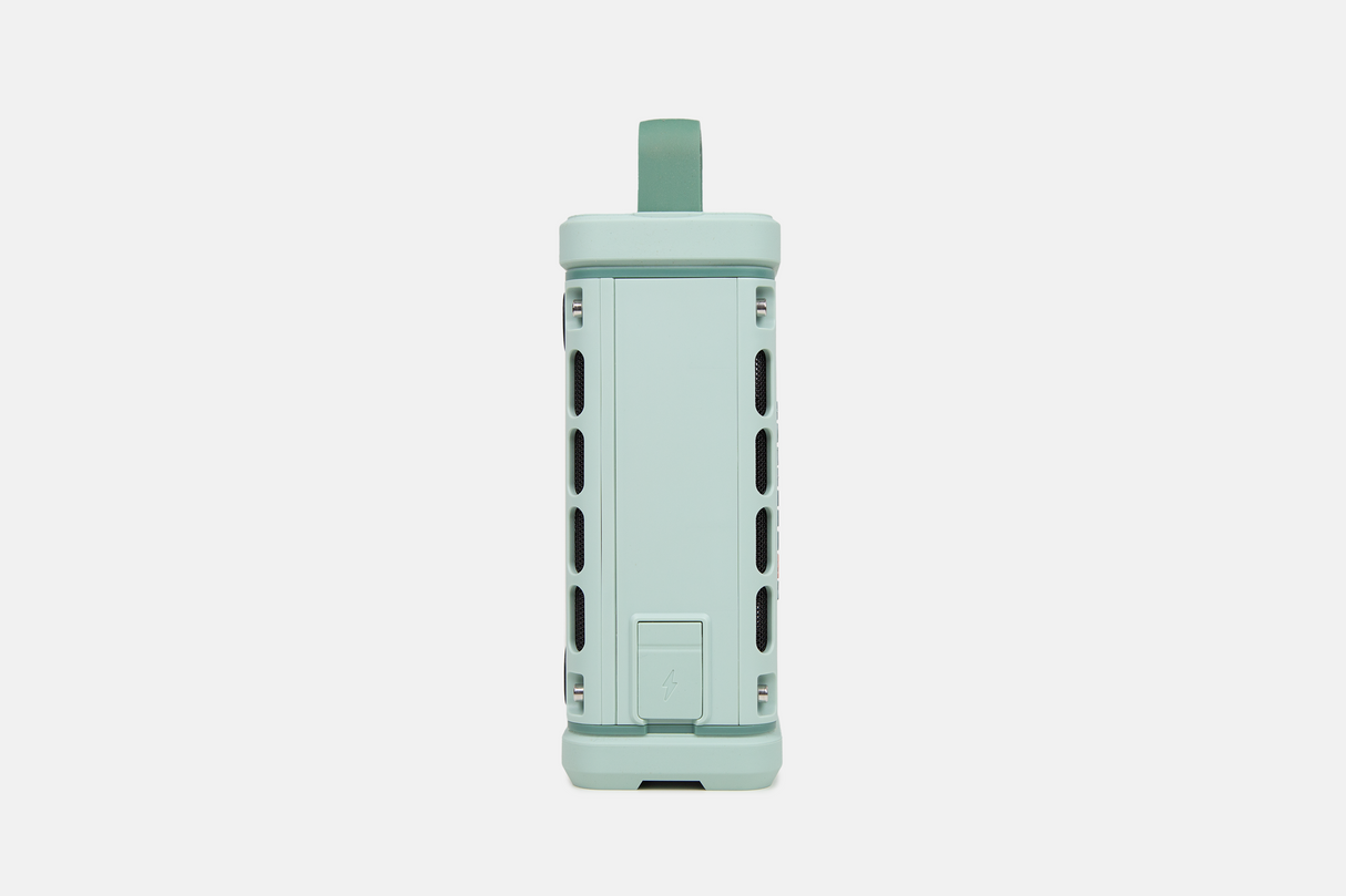 Mint green portable Turtlebox speaker on a white background