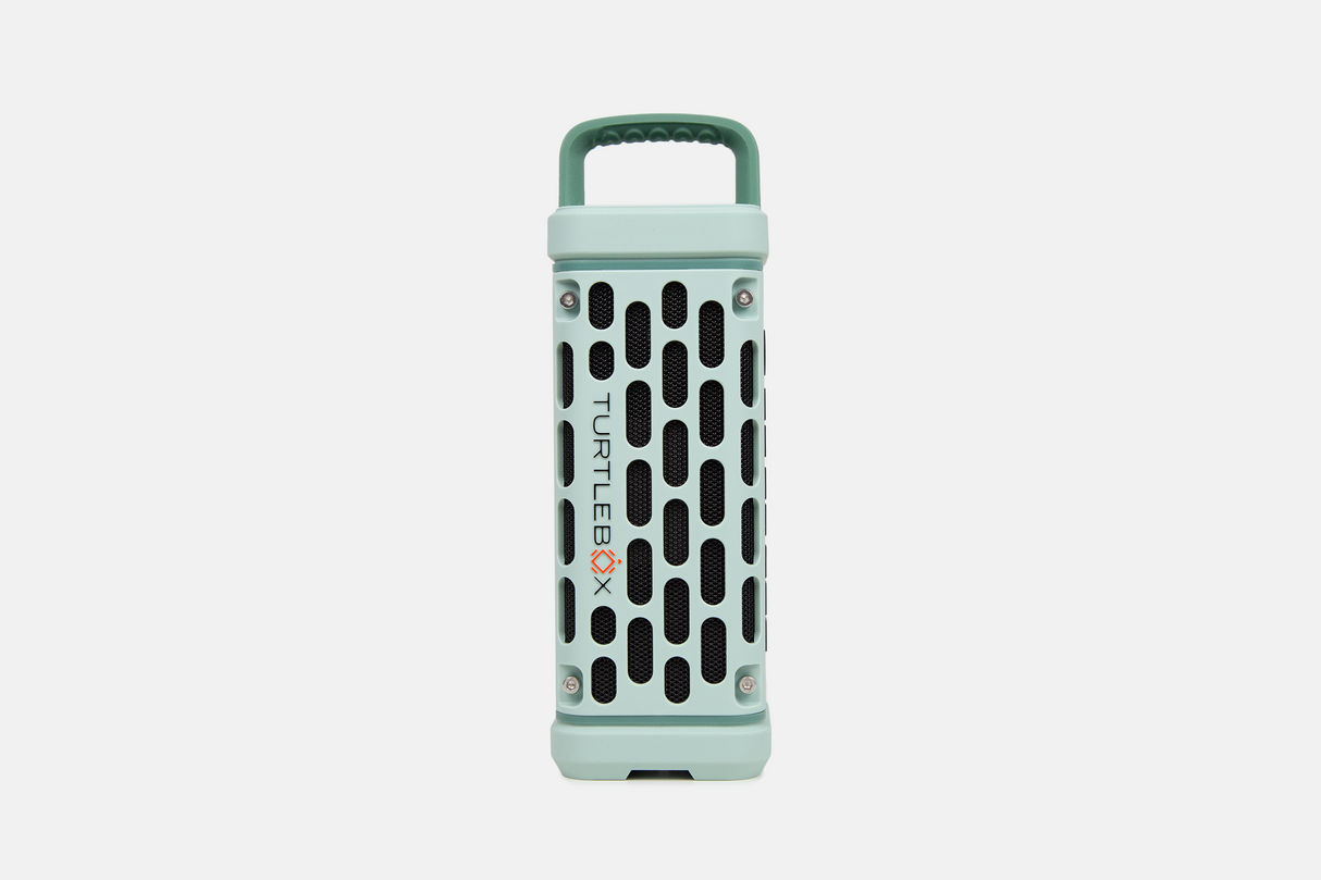 Mint green portable Turtlebox speaker on a white background