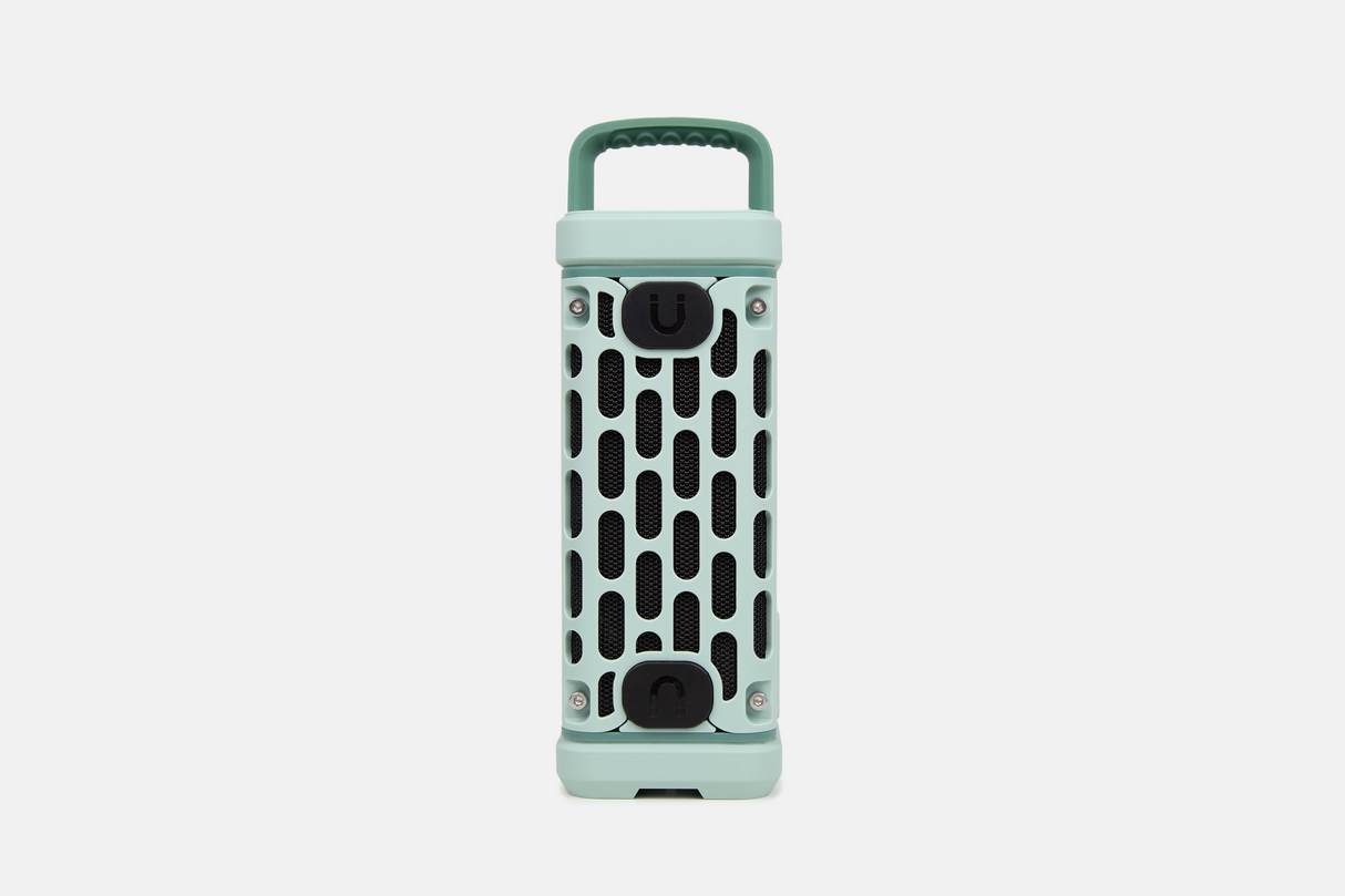Mint green portable Turtlebox speaker on a white background