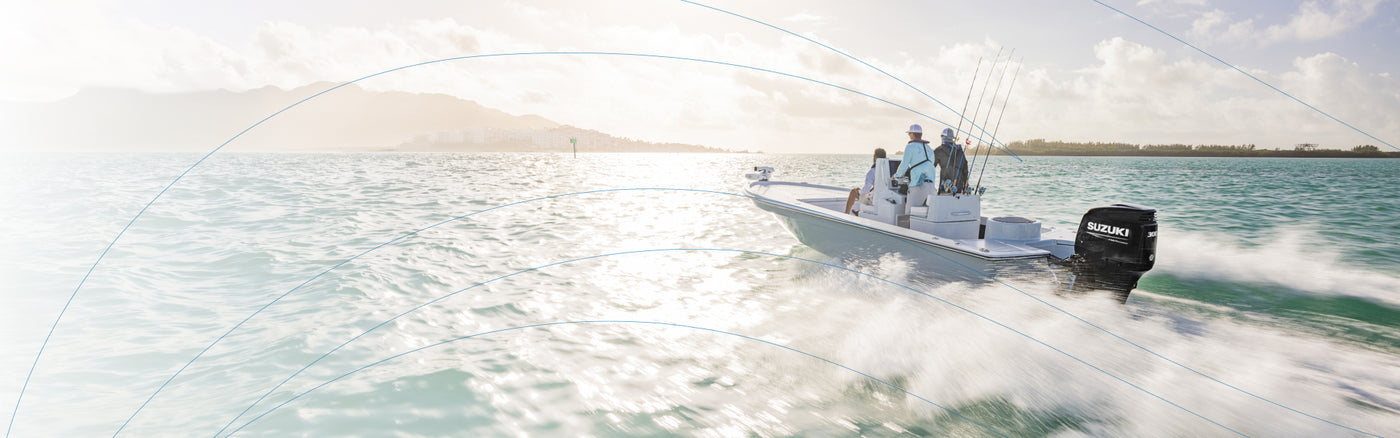 A boat with two people speeds across water, featuring a Suzuki outboard motor on the back.