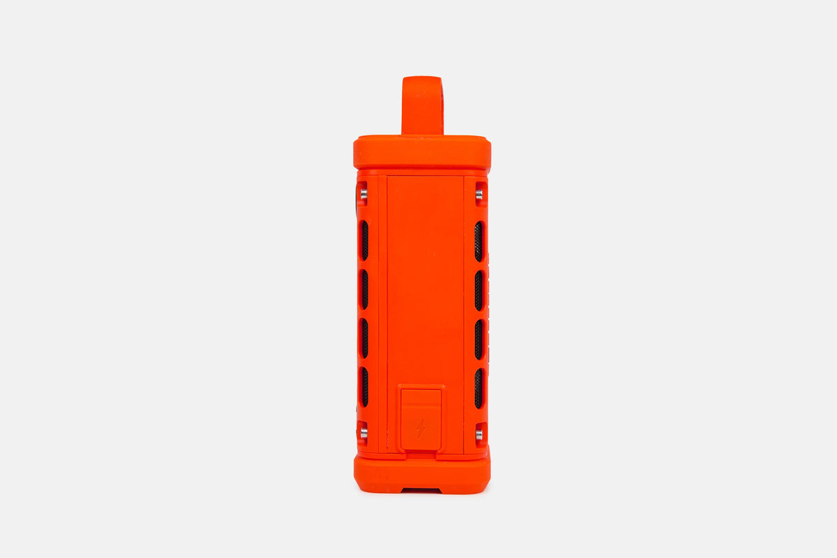 Orange portable Turtlebox speaker on a white background