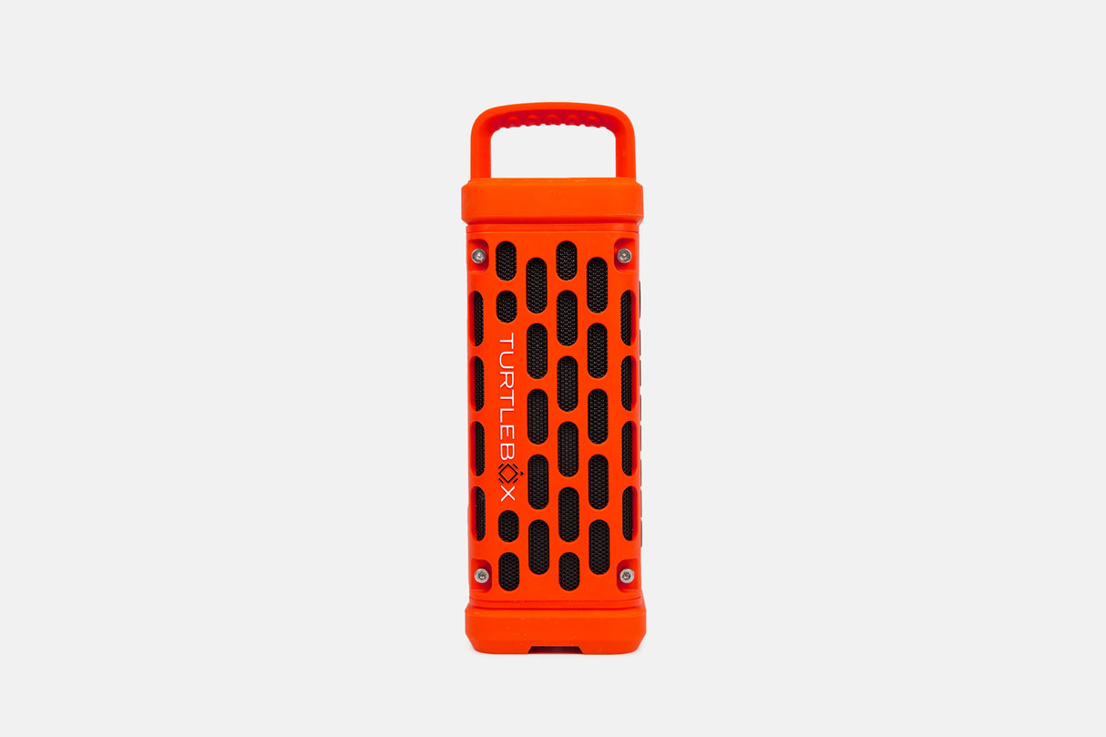 Orange portable Turtlebox speaker on a white background