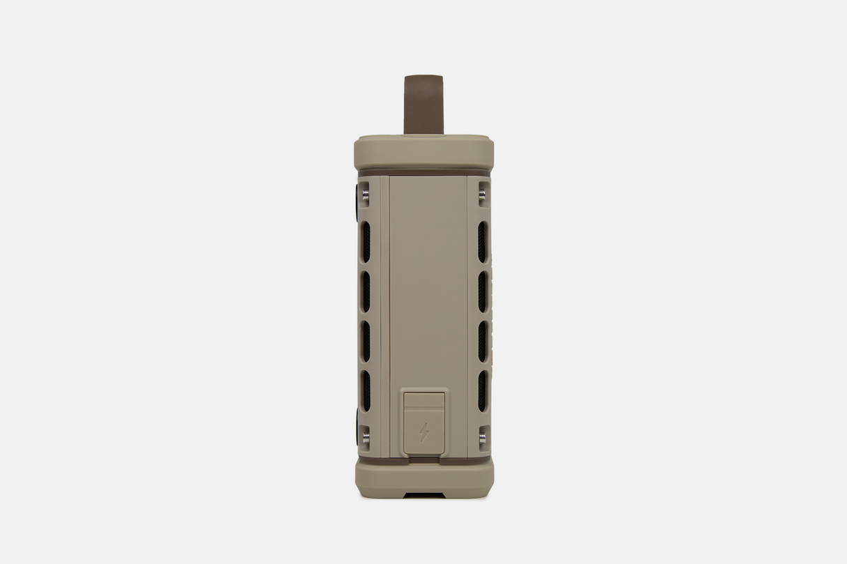 Tan portable Turtlebox speaker on a white background