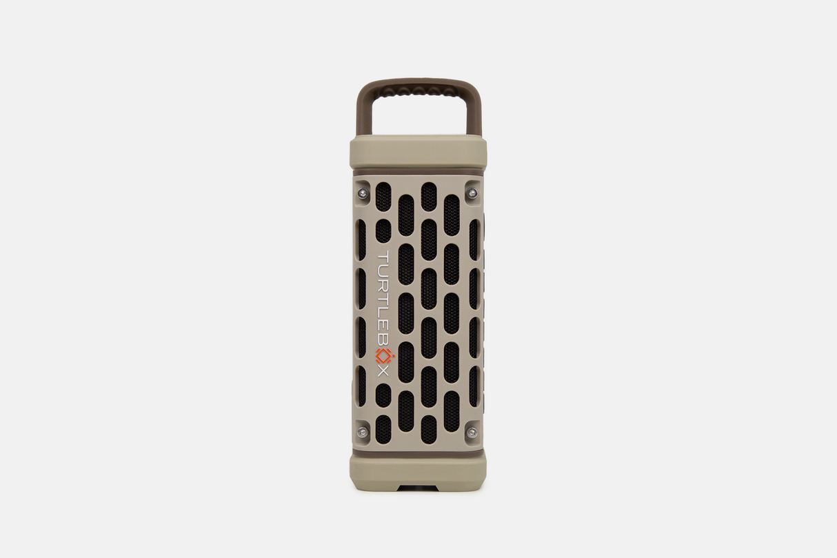 Tan portable Turtlebox speaker on a white background