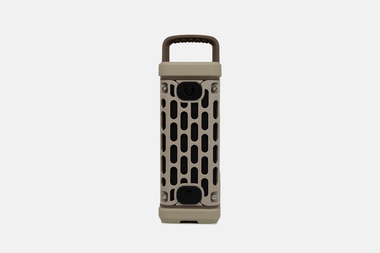 Tan portable Turtlebox speaker on a white background